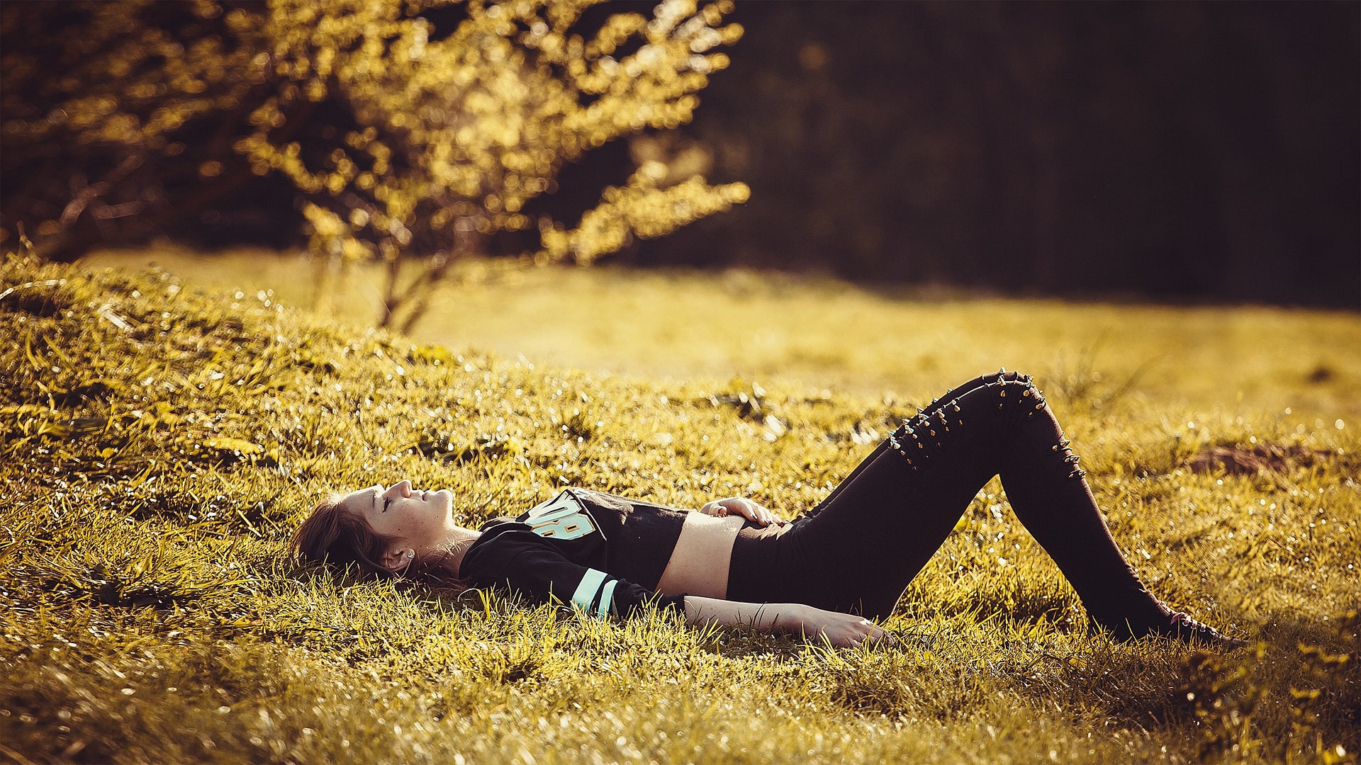 girl lying on the grass gba489833e 1920